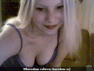 A 320x240 pixel resolution webcam photo of Sunny Crittenden circa 2001. The caption reads "Whoredom relieves boredom :o)".